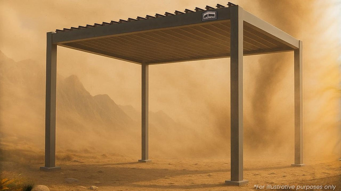 LuxPavilion metal structure in desert sandstorm with mountain backdrop