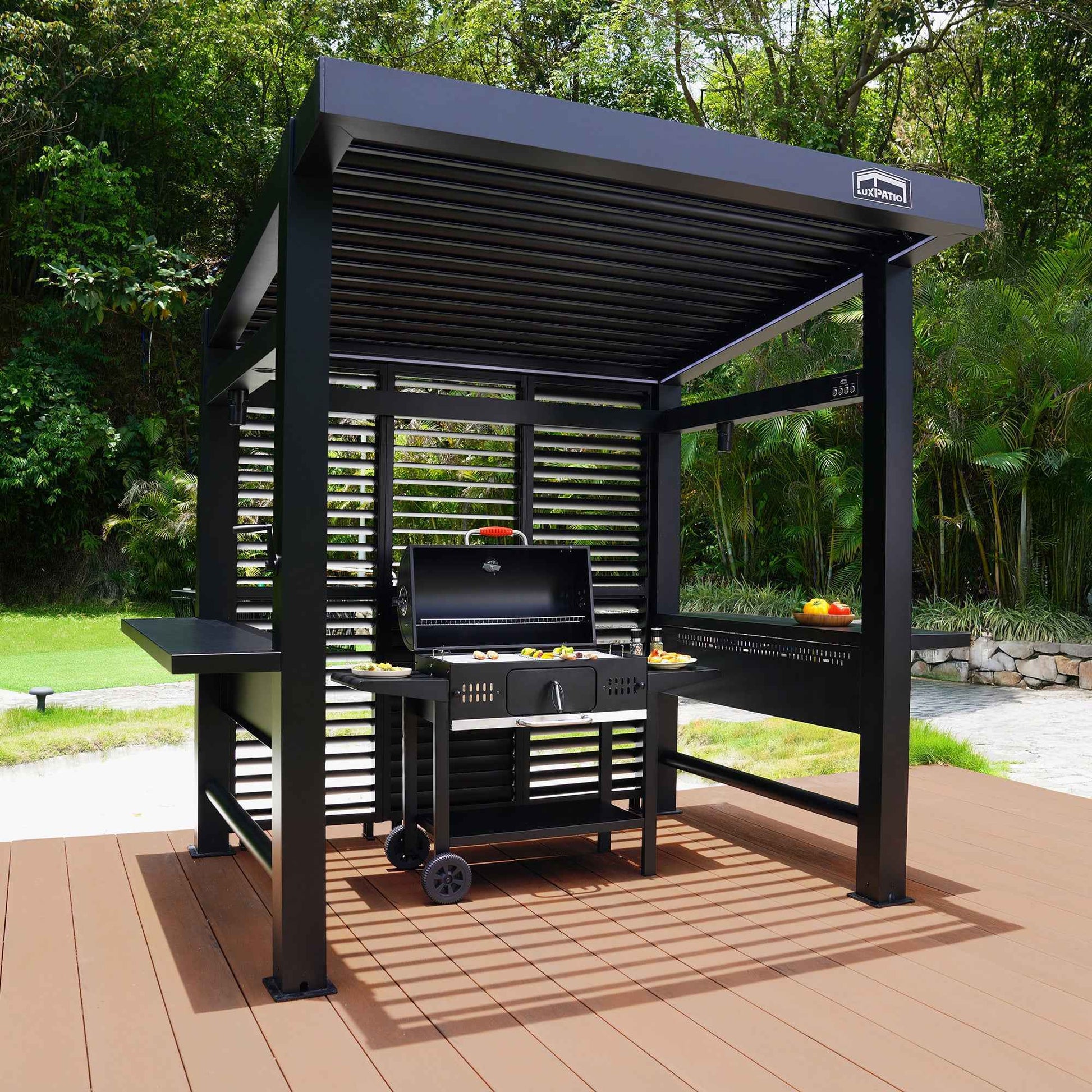 Black LuxPatio Grill Louvered Pergola Lite with grill and side tables, perfect for outdoor entertaining.