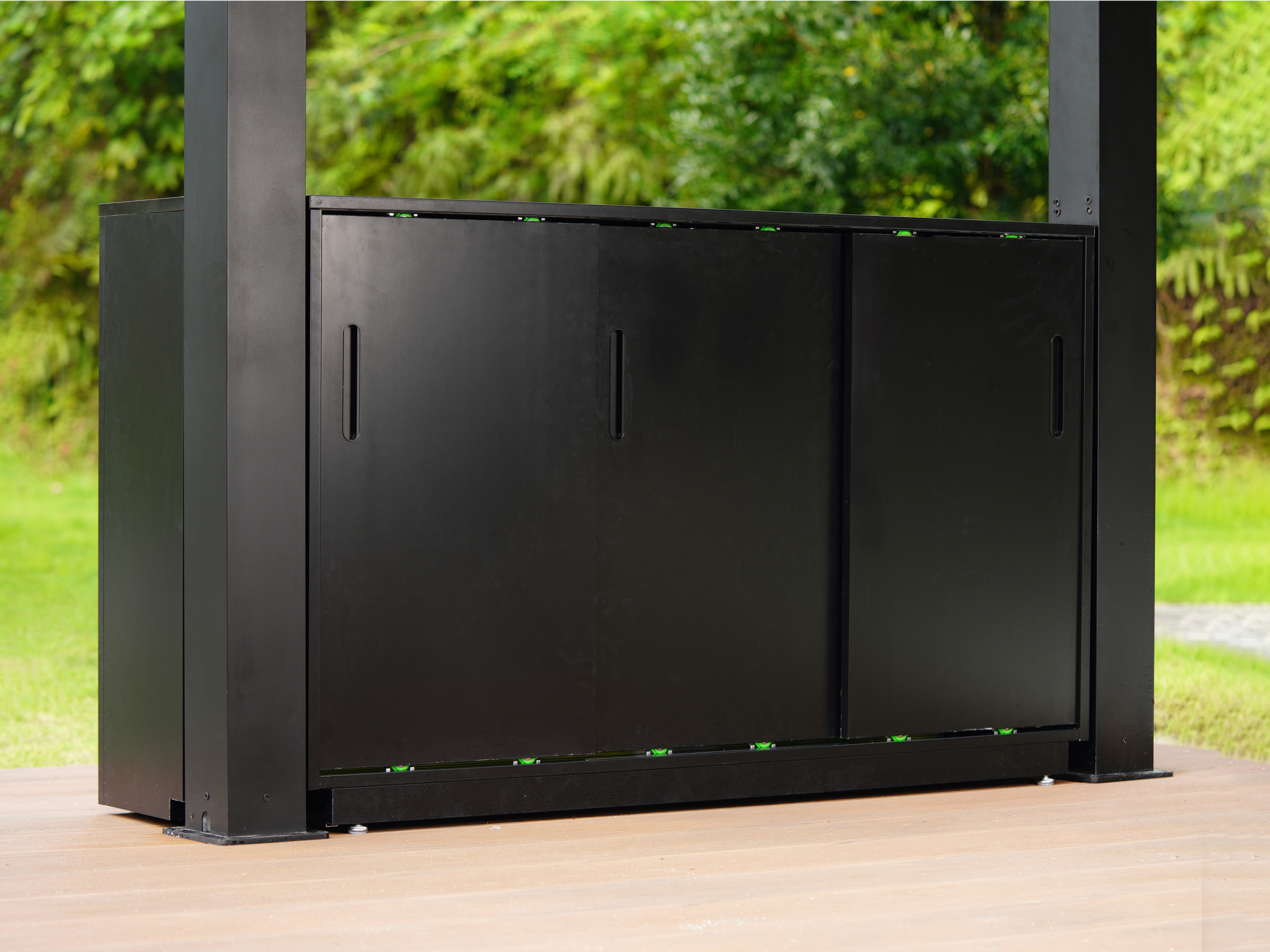Black aluminum grill cabinet for NestGrill with sliding doors for outdoor kitchen storage..